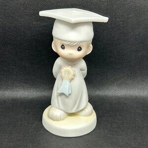 Precious Moments “God Bless You Graduate" figurine